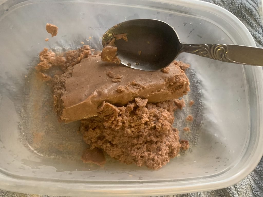 cat eating smalls cat food